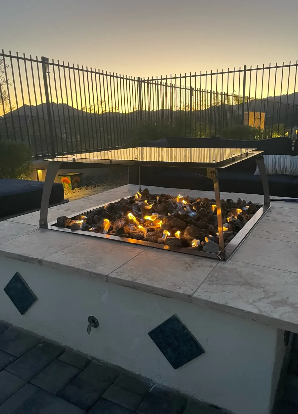 Square heat deflector over an outdoor gas fire feature