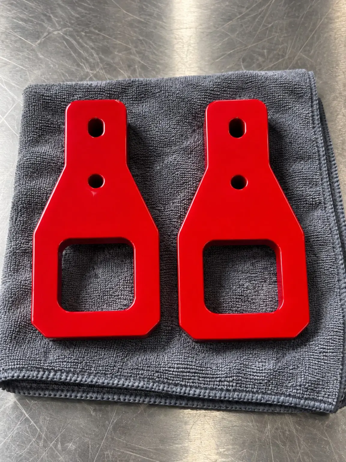 Pair of red powder-coated tow hooks