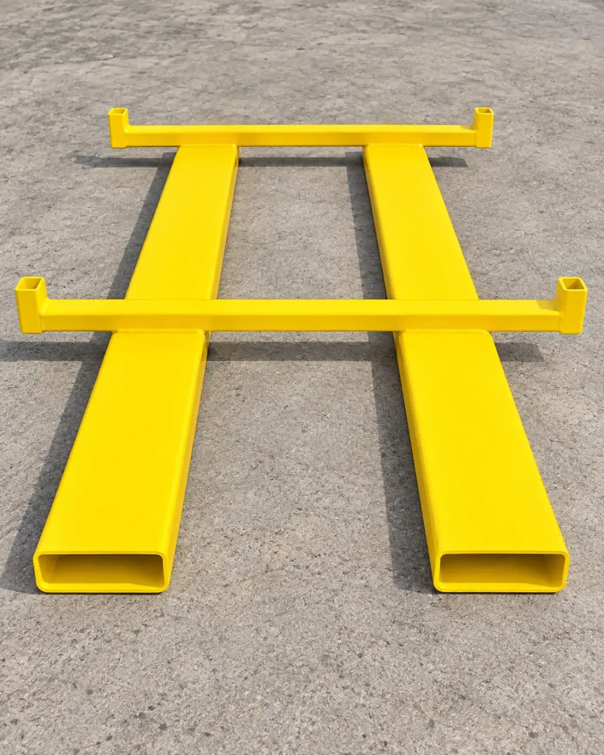 Yellow powder-coated forklift extensions